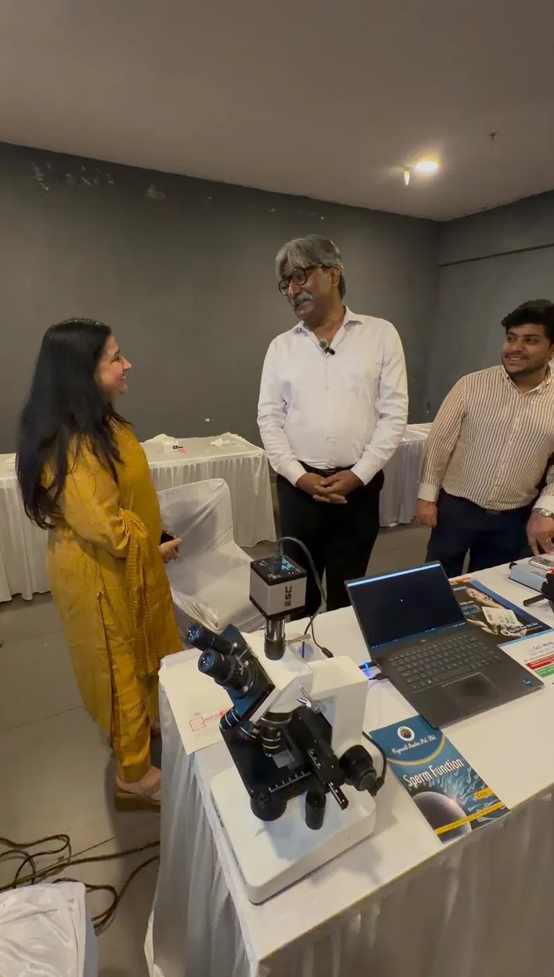 A clinician at the Cell Mate microscope station with Rajnish Sehgal and Mishank Nagpal, FOGSI Fertility Regulation Conclave 2026